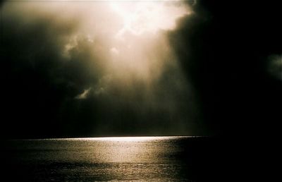 Scenic view of sea against sky at night