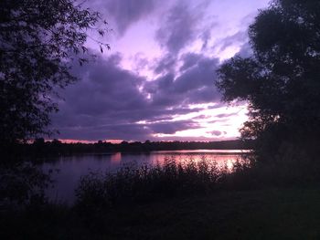 Scenic view of lake against sky during sunset