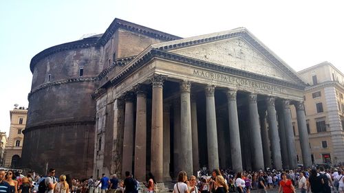 Group of people in front of historical building