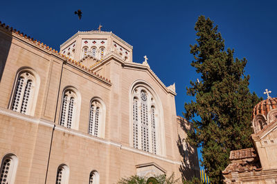 Low angle view of church against clear blue sky