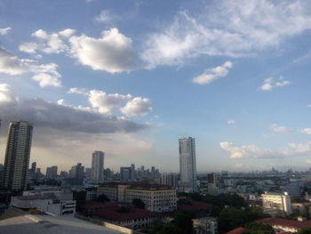 Modern buildings in city against sky