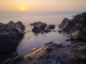 Scenic view of sea against sky during sunset