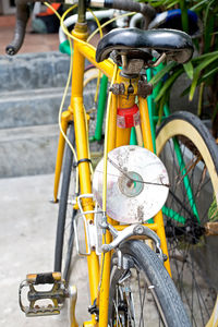 Close-up of bicycle parked on street