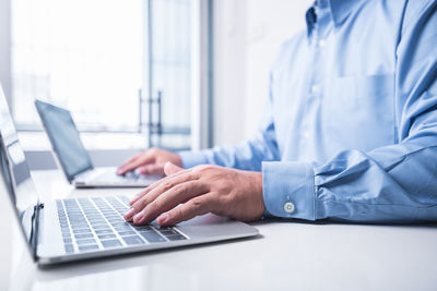 Man using laptop on table