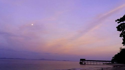 Scenic view of sea against sky at sunset