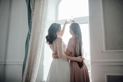 Couple standing in corridor of building