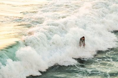 High angle view of surfer on sea