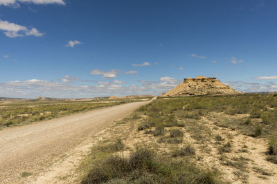 Road amidst landscape against sky