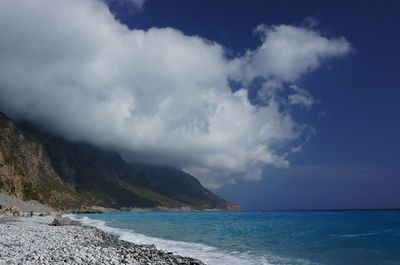 Dramatic seascape with clouds over coastline