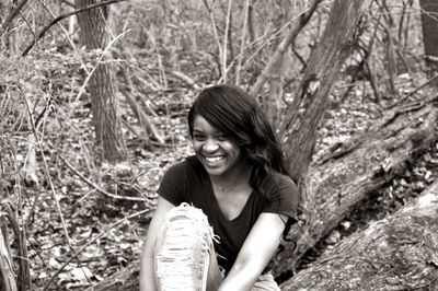 Portrait of young woman in forest