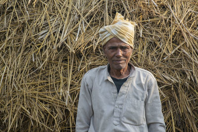Portrait of man standing in farm