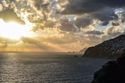 Scenic view of sea against cloudy sky