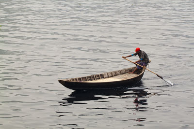 High angle view of man on boat in lake