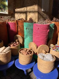Various flowers in basket for sale at market stall