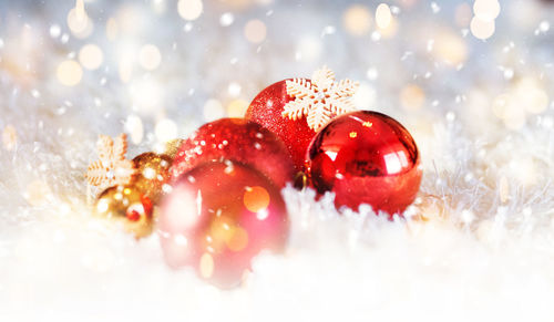 Close-up of christmas ornaments on fur