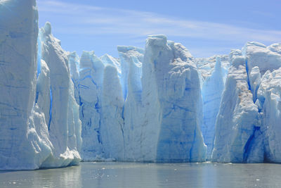 Blue ice columns of the grey glacier on  grey lake in torres del paine in patagonian chile