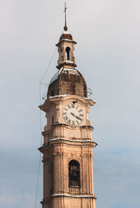 Low angle view of clock tower against sky