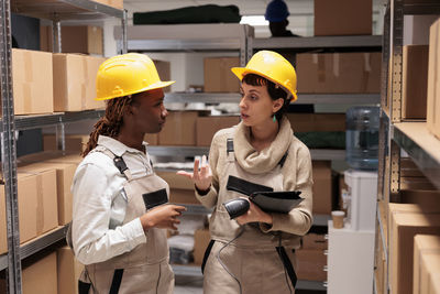 Rear view of engineer working in factory