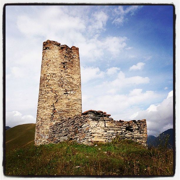 architecture, built structure, sky, building exterior, history, old ruin, cloud - sky, grass, old, stone wall, the past, low angle view, cloud, damaged, ancient, ruined, abandoned, cloudy, castle, day