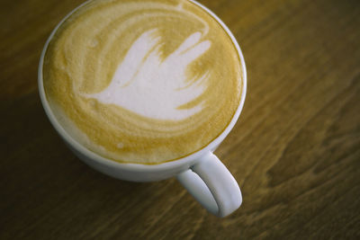 High angle view of cappuccino on table