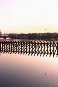 Scenic view of pier against clear sky during sunset