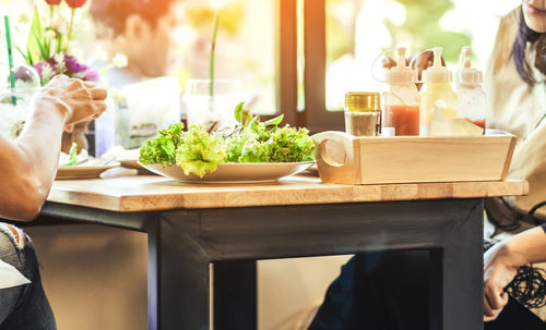 Midsection of food on table at restaurant