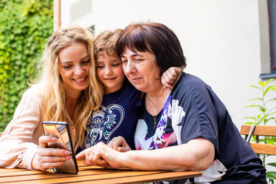 Happy woman using mobile phone