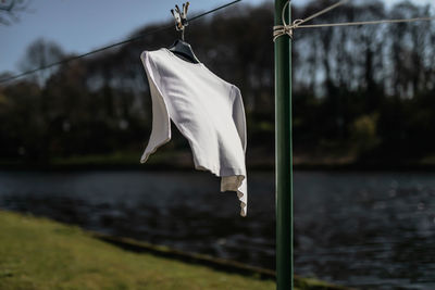 Close-up of clothes drying on the lake