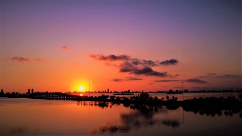 Scenic view of sea against romantic sky at sunset