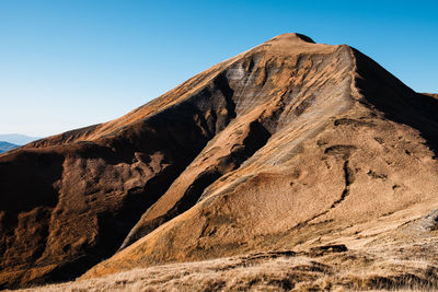 Low angle view of rock formation against sky in amatrice lazio, italy 