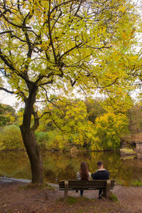 People relaxing in park during autumn