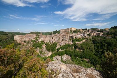 Panoramic view of historic building of sorano in tuscany against sky