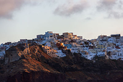 Buildings in city against sky