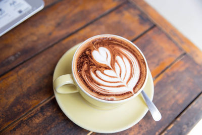 Close-up of cappuccino on table