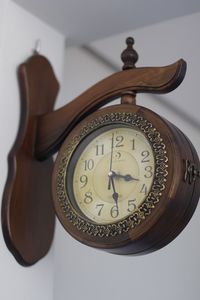 Close-up of clock on table