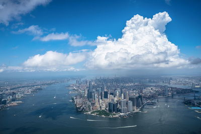 High angle view of buildings against cloudy sky