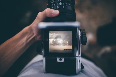 Close-up of hand holding camera