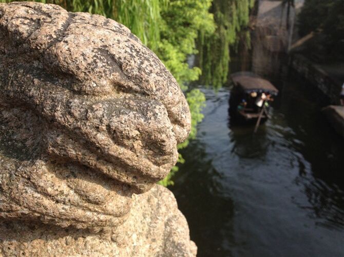 water, rock - object, rock formation, sculpture, nature, rock, statue, outdoors, human representation, reflection, day, tranquility, waterfront, lake, nautical vessel, river, travel, art and craft, beauty in nature, boat