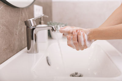 Midsection of man in bathroom