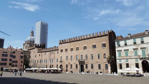 Buildings in city against sky