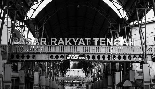 Low angle view of text on railroad station