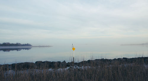 Scenic view of land against sky during sunset