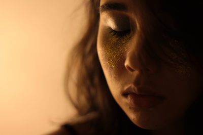 Close-up of woman with glitter make-up