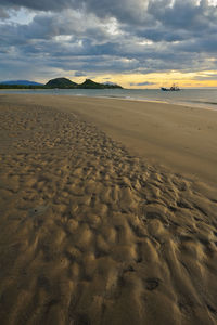 Scenic view of beach against sky during sunset