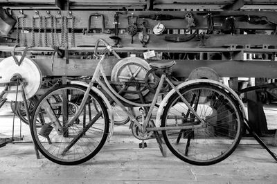 Bicycle parked by railing in city