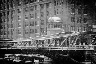 View of bridge in city during winter