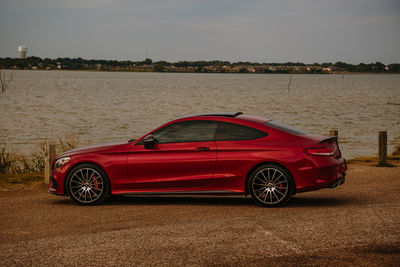 Toy car on land against sky