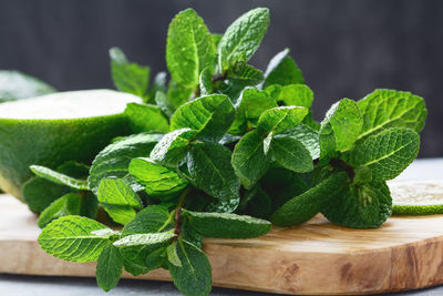 Close-up of mint on cutting board at table