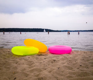 Inflatable rings on sandy beach