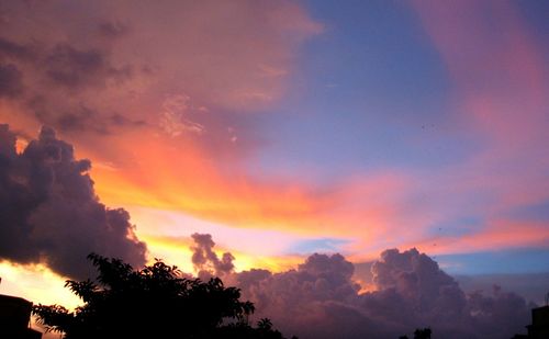 Low angle view of cloudy sky at sunset